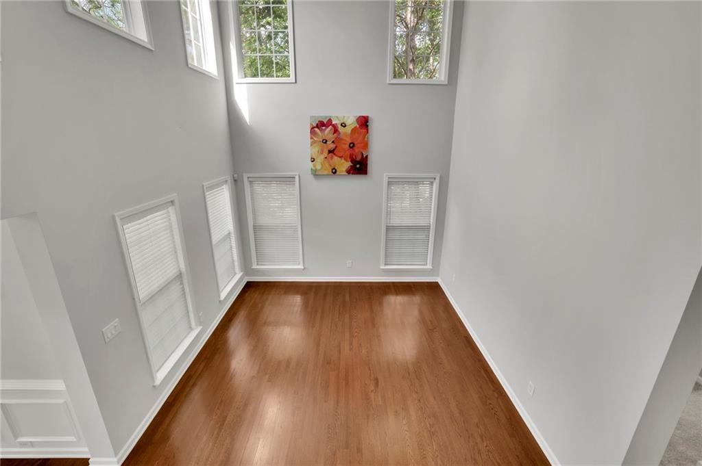 2945 Links View Way Cumming, GA 30041 - Photo 12 of 25 a view of a hallway with wooden floor
