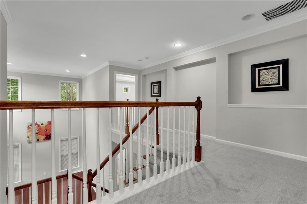2945 Links View Way Cumming, GA 30041 - Photo 16 of 25 a view of a hallway with wooden floor and windows