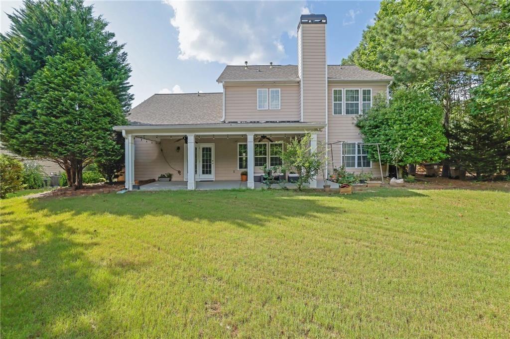 2945 Links View Way Cumming, GA 30041 - Photo 21 of 25 a front view of a house with swimming pool