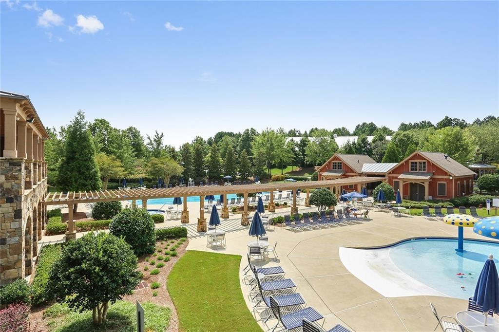 2945 Links View Way Cumming, GA 30041 - Photo 23 of 25 a view of a swimming pool and lounge chairs