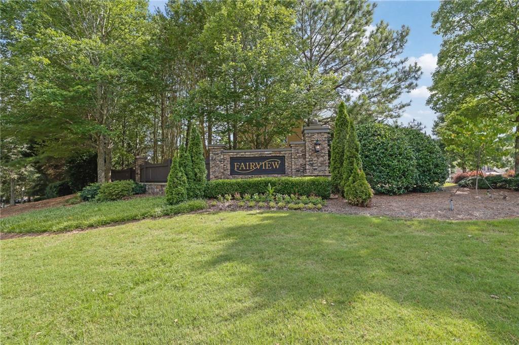 2945 Links View Way Cumming, GA 30041 - Photo 4 of 25 a view of a backyard with plants and large trees