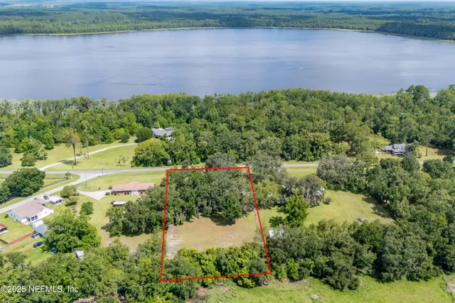 a view of a lake with a yard