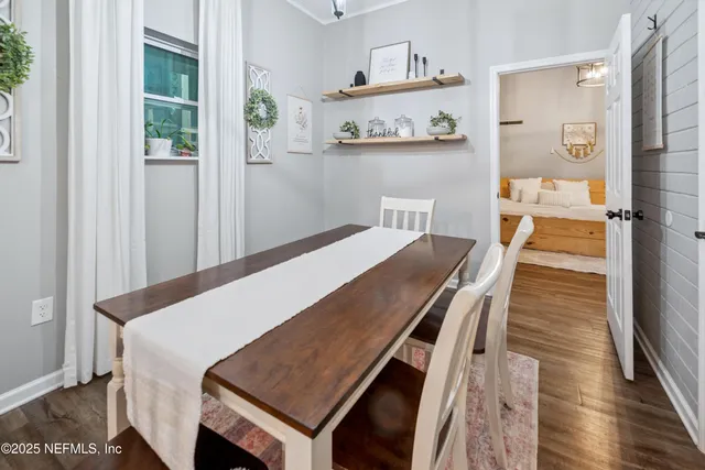 a spacious bedroom with a bed and a chandelier