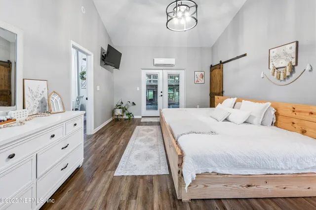 a bedroom with a bed and a couch