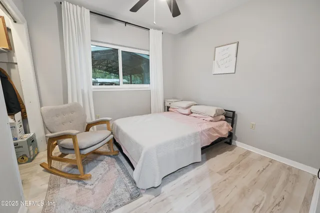 a bed room with a bed and a window