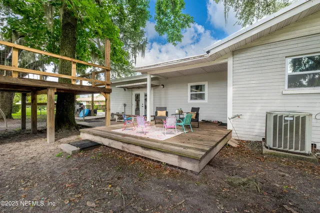 a view of a backyard with a garden and entertaining space