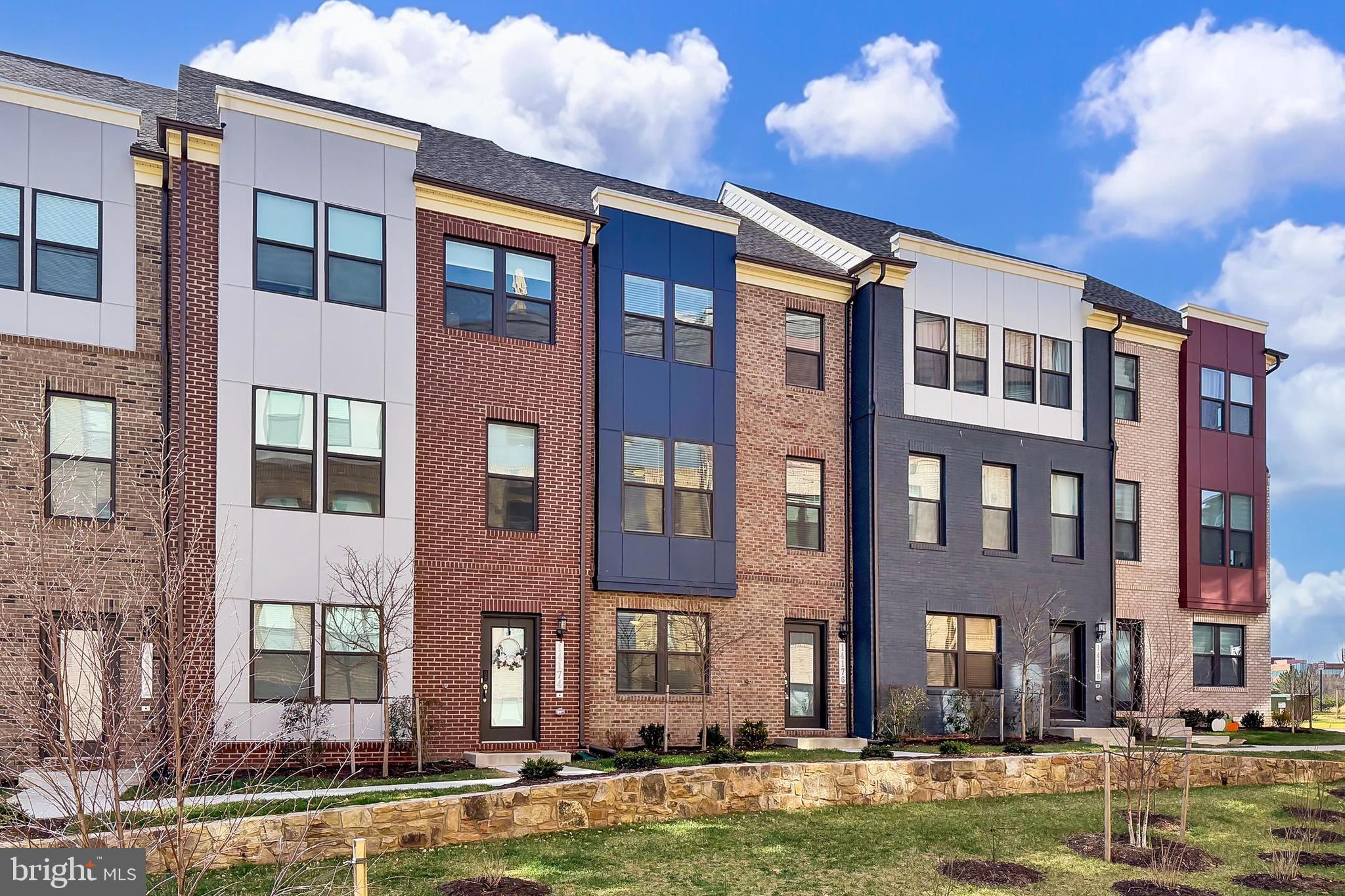 14176 Gypsum Loop Chantilly, VA 20151 - Photo 1 of 44 a front view of a building with a swimming pool