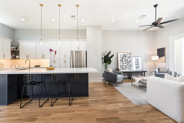 a view of kitchen with cabinets and wooden floor