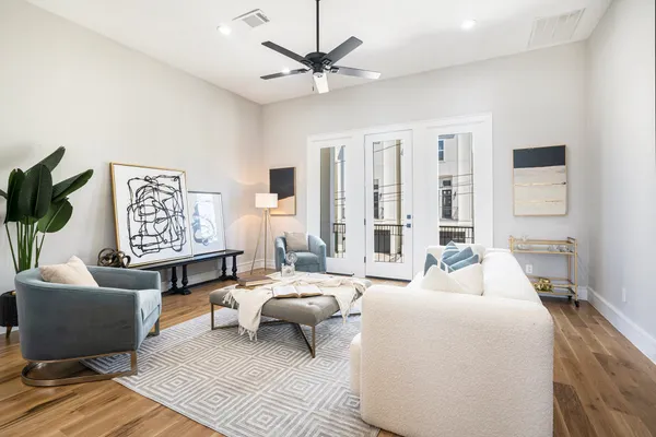 a living room with furniture and a large window