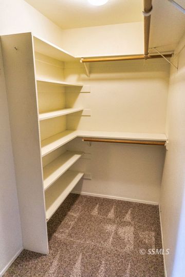 512 Amanda Street Ridgecrest, CA 93555 - Photo 34 of 44 a view of walk in closet with empty racks
