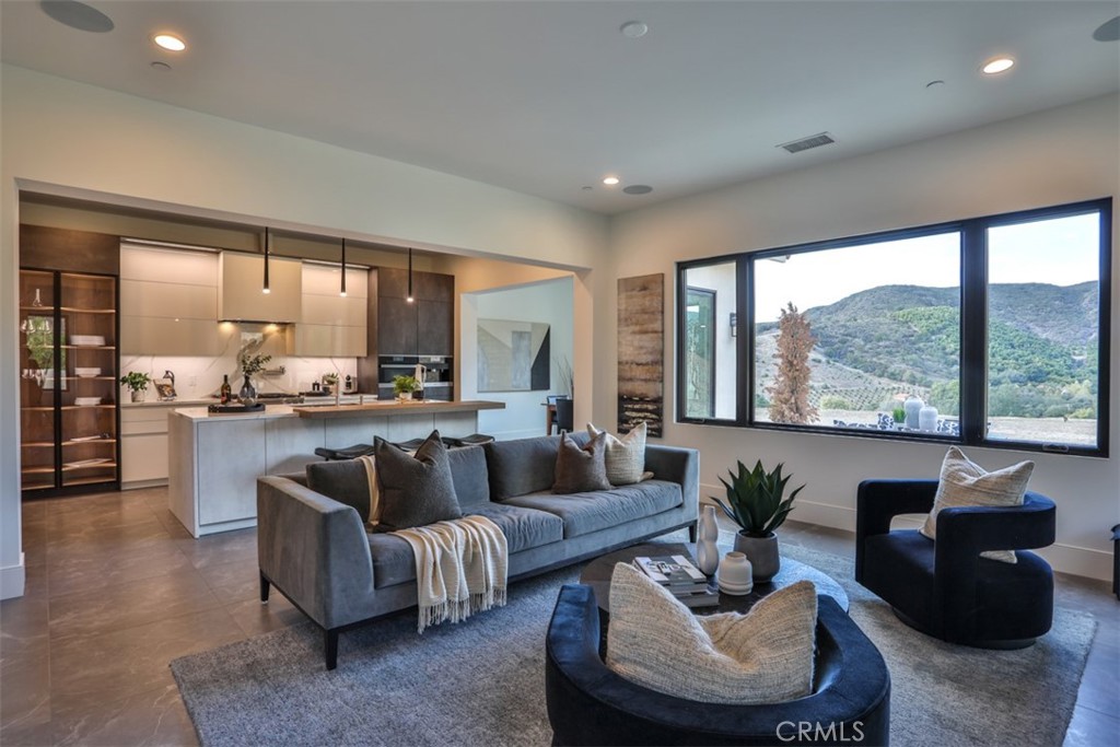 43698 De Luz Road Temecula, CA 92590 - Photo 14 of 60 a living room with furniture and a large window