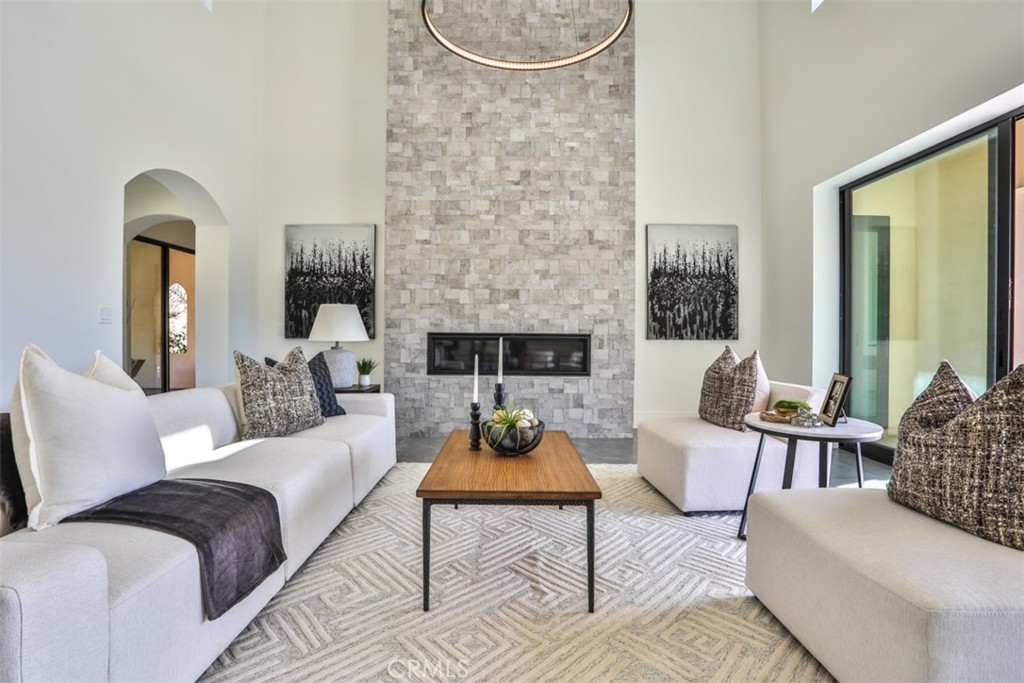 43698 De Luz Road Temecula, CA 92590 - Photo 16 of 60 a living room with furniture and a fireplace