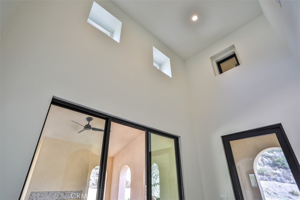 43698 De Luz Road Temecula, CA 92590 - Photo 19 of 60 a view of a hallway with a large window