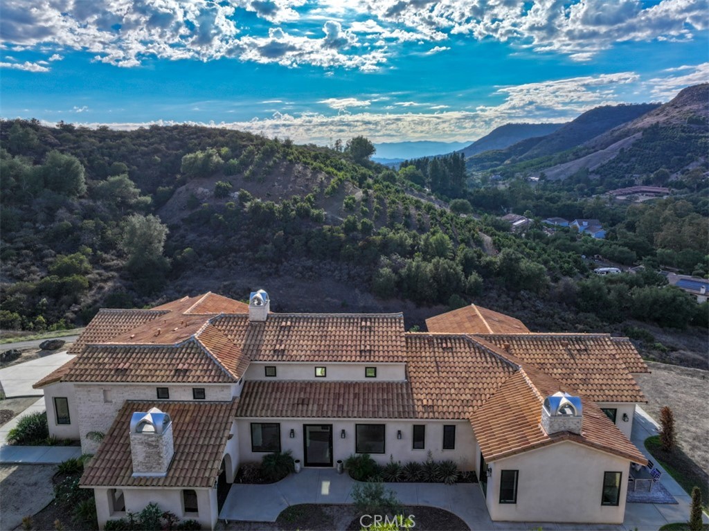 43698 De Luz Road Temecula, CA 92590 - Photo 4 of 60 an aerial view of residential houses with outdoor space
