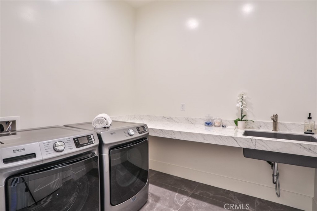 43698 De Luz Road Temecula, CA 92590 - Photo 45 of 60 a utility room with dryer and washer