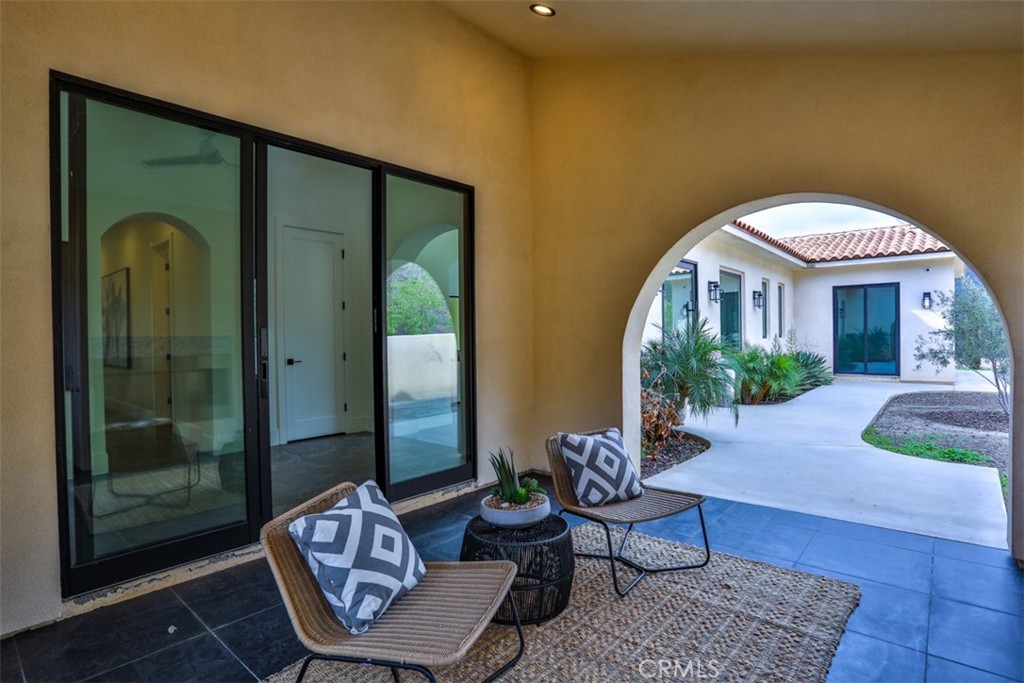 43698 De Luz Road Temecula, CA 92590 - Photo 50 of 60 a living room with furniture and a large window
