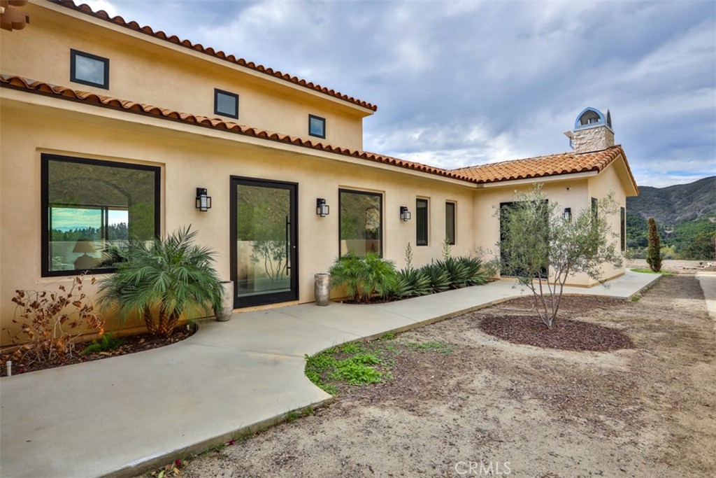 43698 De Luz Road Temecula, CA 92590 - Photo 51 of 60 a front view of a house with garden