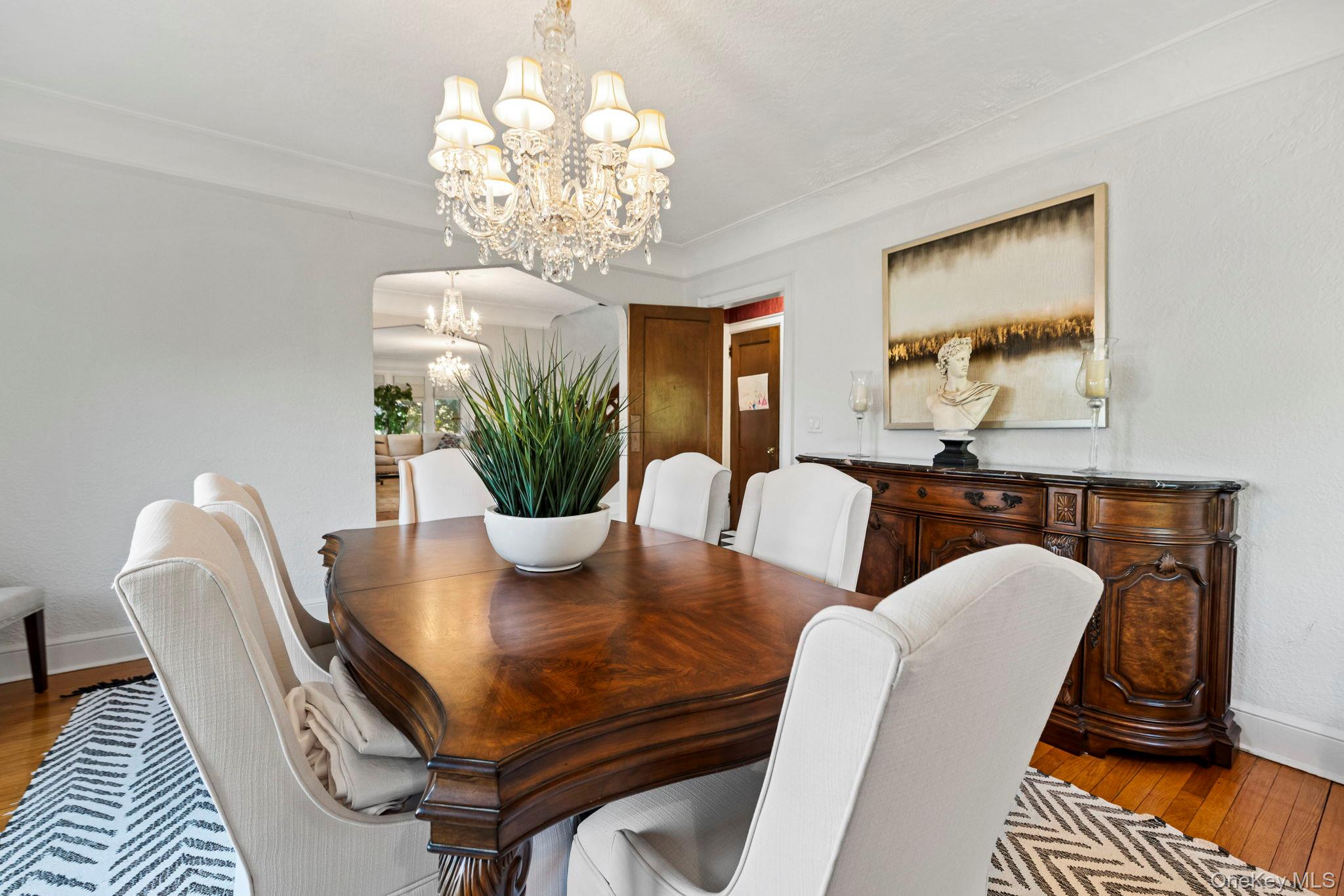 44 Fenimore Road New Rochelle, NY 10804 - Photo 9 of 46 a dining room with furniture and chandelier