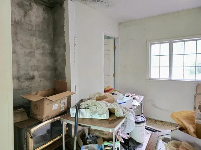 a kitchen with stainless steel appliances granite countertop a stove top oven a sink dishwasher and cabinets with wooden floor