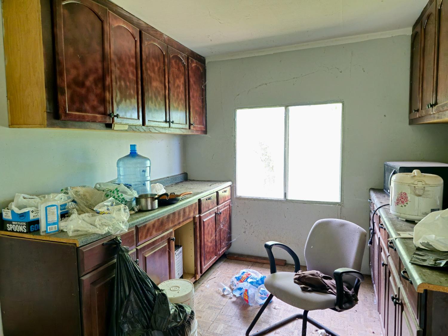 0 Elams Ranch Road Oroville, CA 95966 - Photo 12 of 24 a kitchen with stainless steel appliances granite countertop a stove top oven a sink dishwasher and cabinets with wooden floor