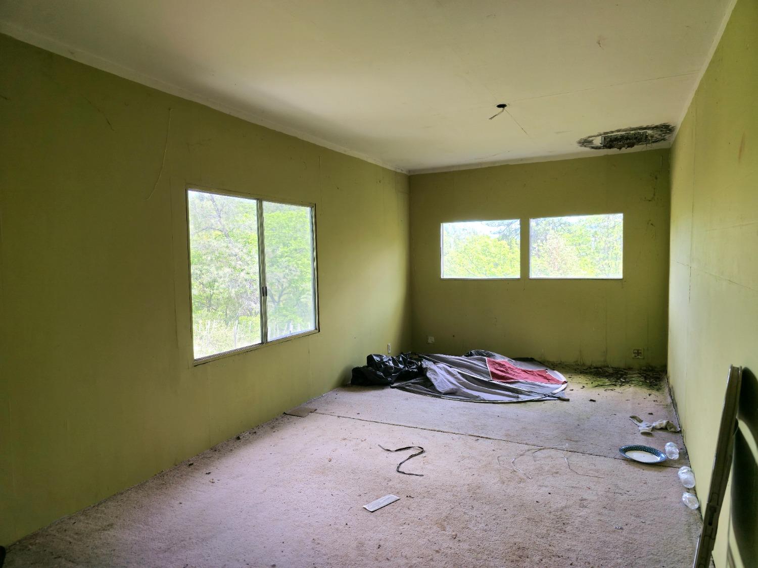 0 Elams Ranch Road Oroville, CA 95966 - Photo 13 of 24 a bedroom with a bed and a window