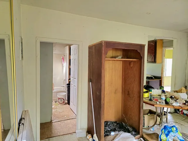 a room with furniture and wooden floor