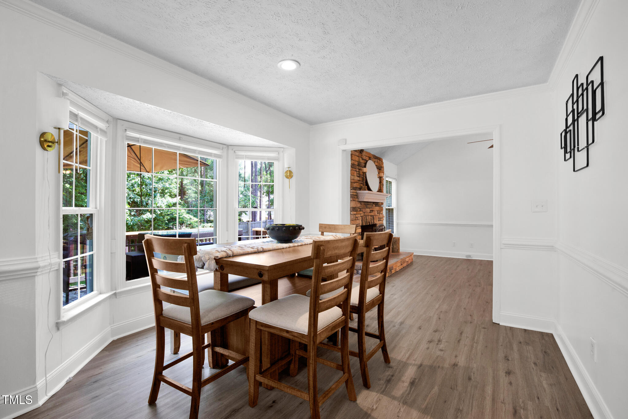 7832 Shuttle Road Fayetteville, NC 28311 - Photo 14 of 35 a view of a dining room with furniture window and wooden floor
