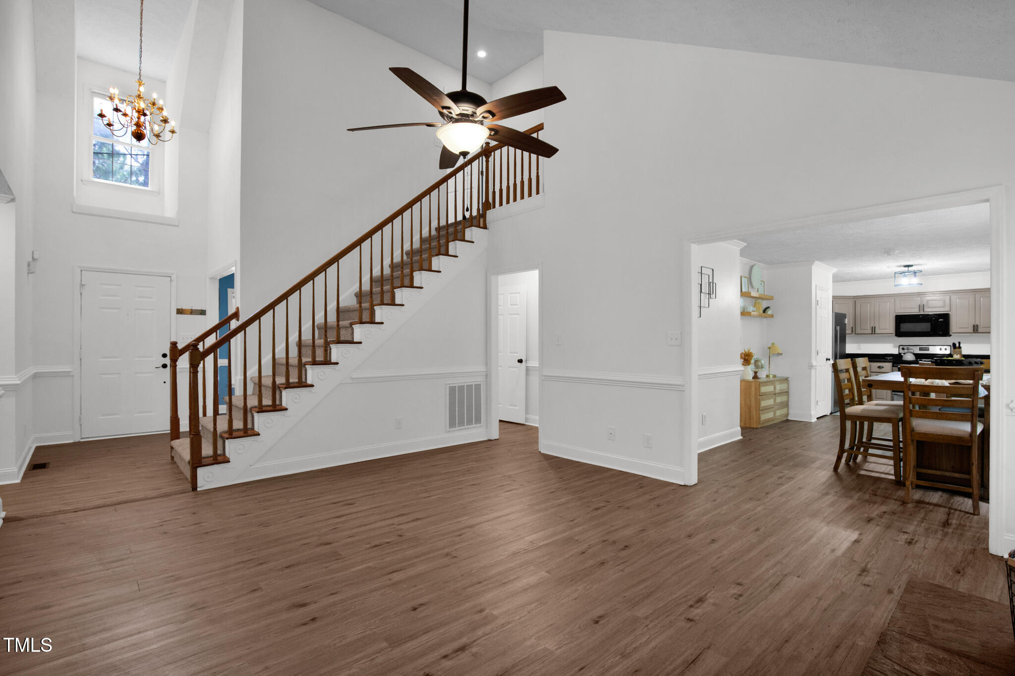 7832 Shuttle Road Fayetteville, NC 28311 - Photo 2 of 35 a view of an entryway with wooden floor and a ceiling fan