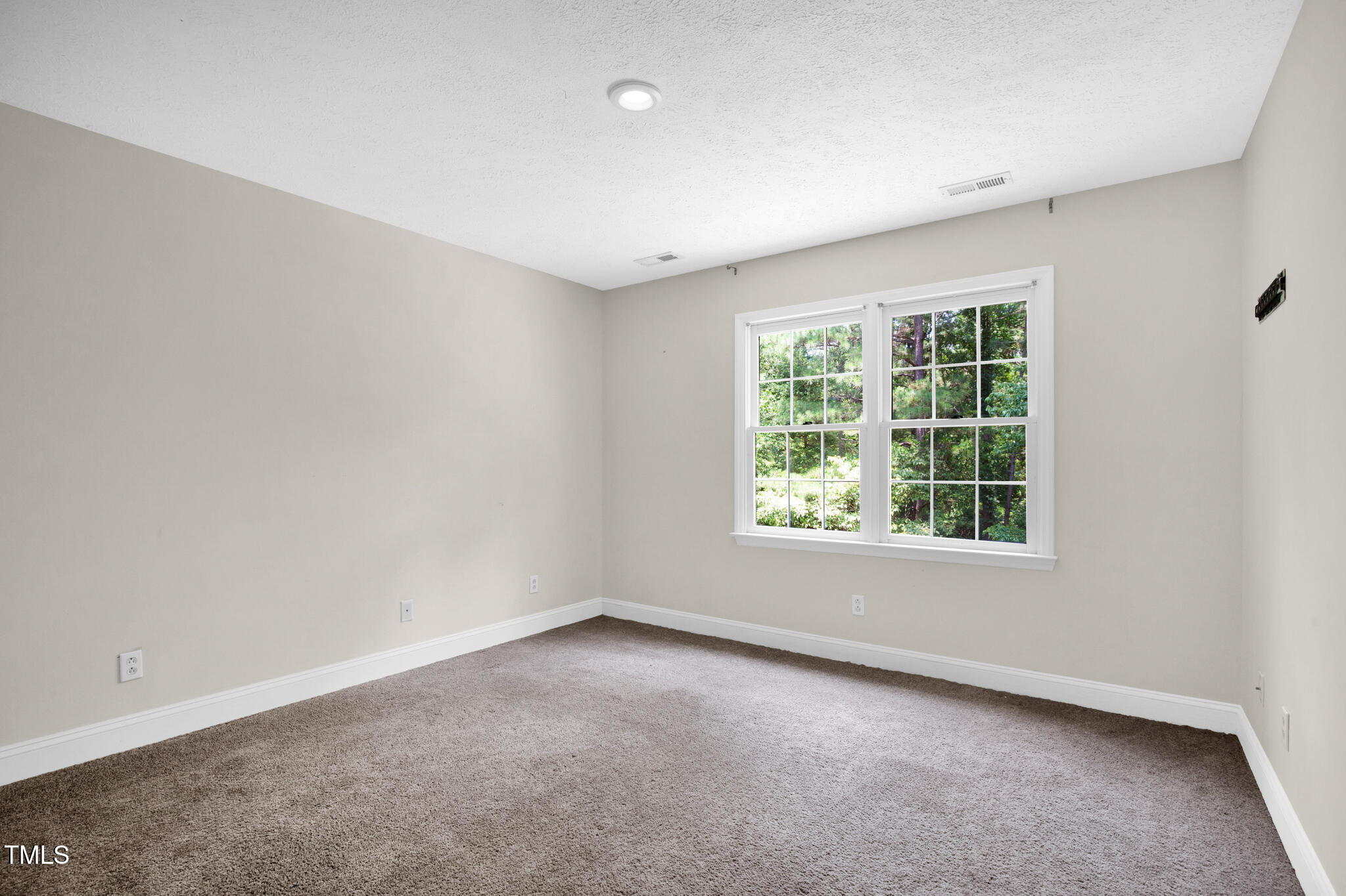 7832 Shuttle Road Fayetteville, NC 28311 - Photo 21 of 35 an empty room with windows