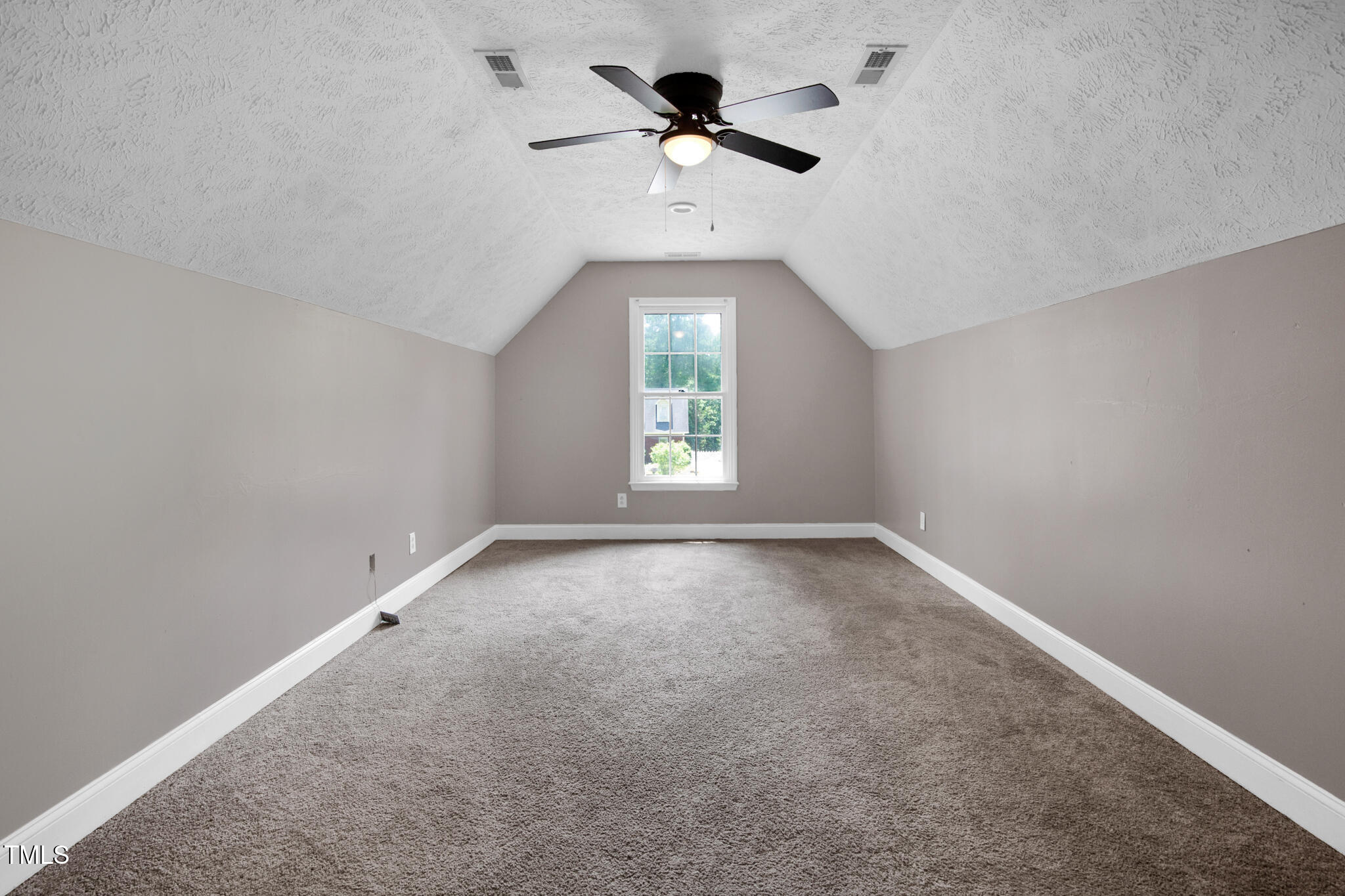 7832 Shuttle Road Fayetteville, NC 28311 - Photo 23 of 35 an empty room with a window and a fan