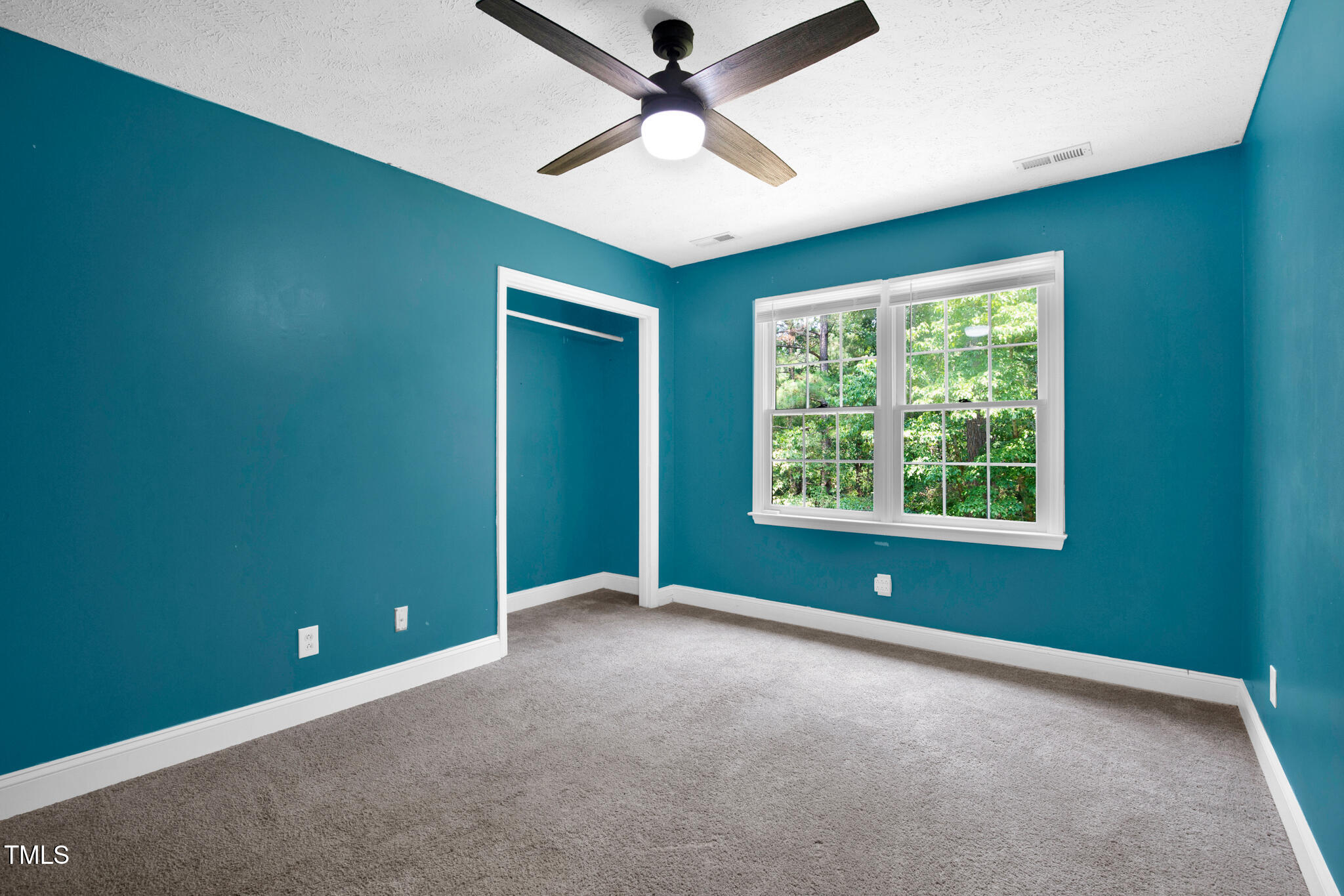 7832 Shuttle Road Fayetteville, NC 28311 - Photo 26 of 35 an empty room with ceiling fan and window