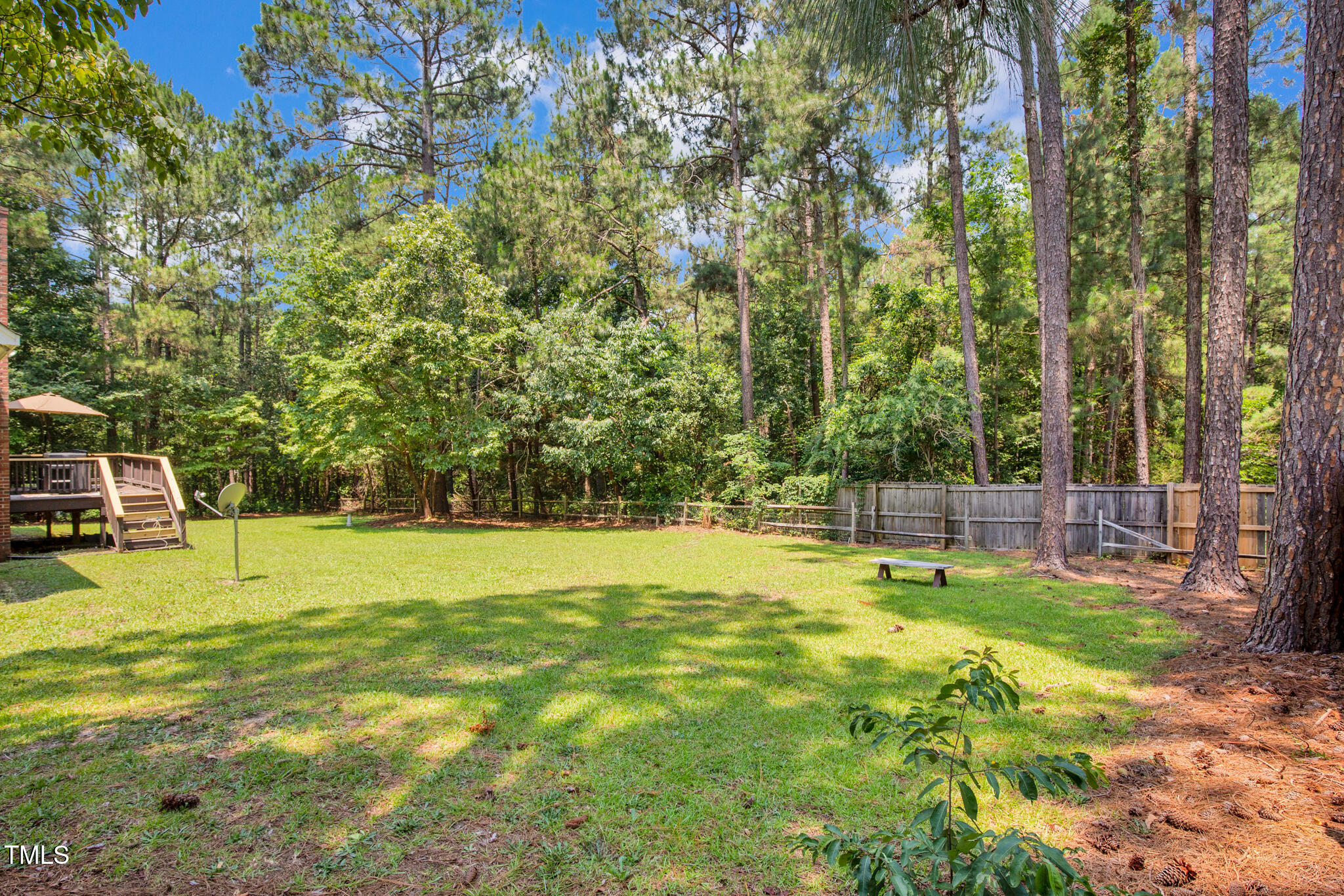 7832 Shuttle Road Fayetteville, NC 28311 - Photo 30 of 35 a swimming pool with wooden fence