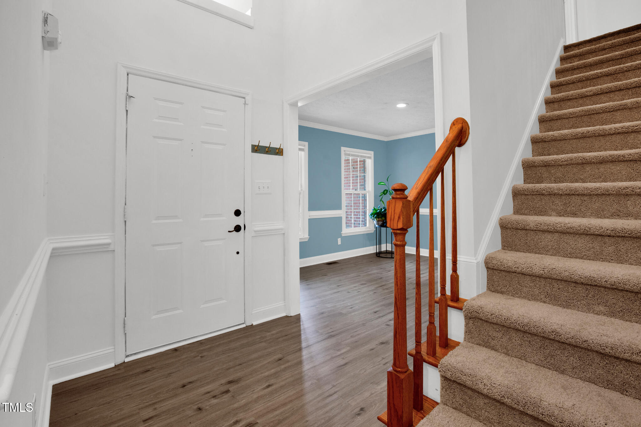 7832 Shuttle Road Fayetteville, NC 28311 - Photo 6 of 35 a view of entryway with wooden floor and stairs