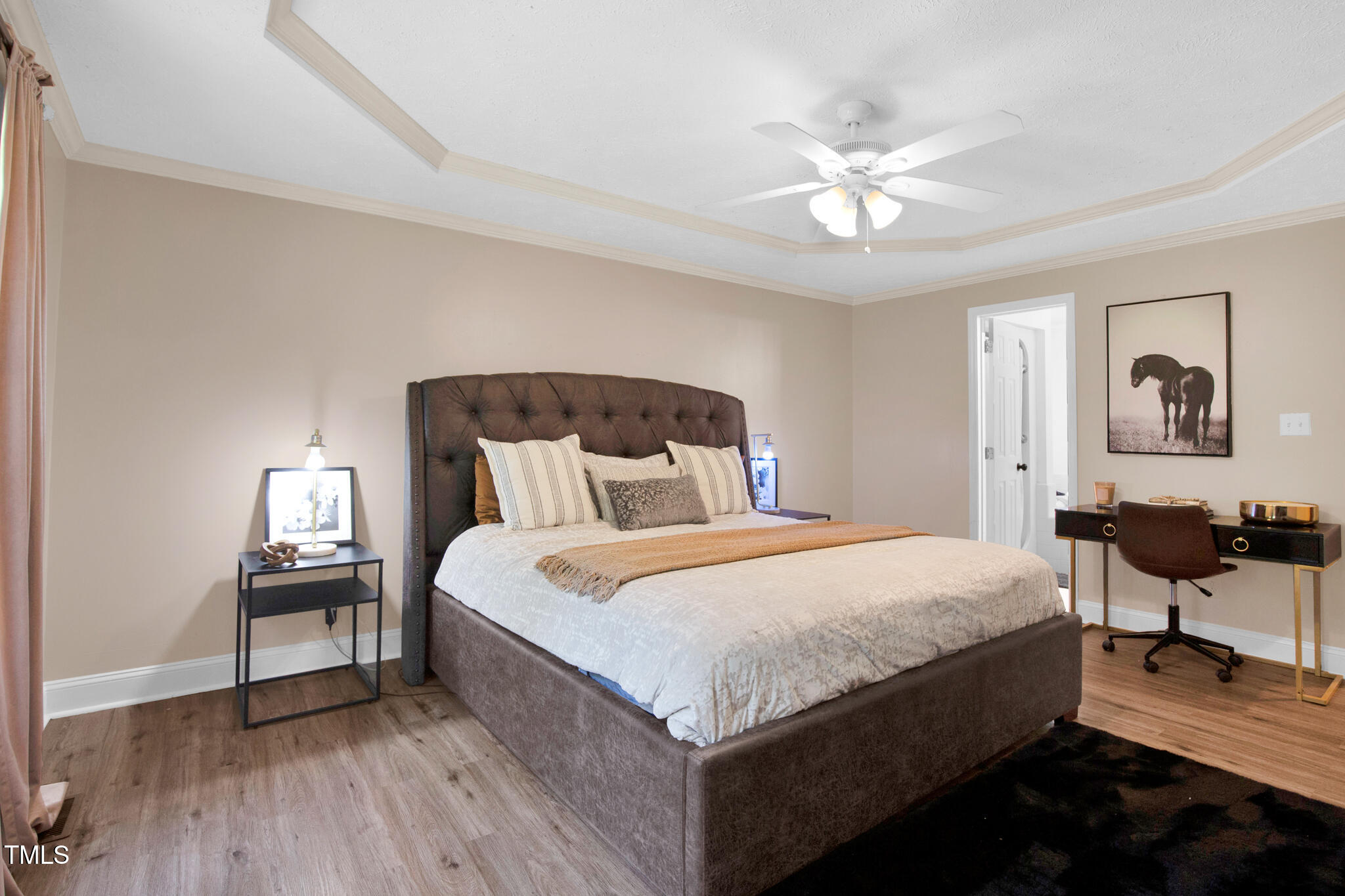7832 Shuttle Road Fayetteville, NC 28311 - Photo 9 of 35 a bedroom with bed and a chandelier