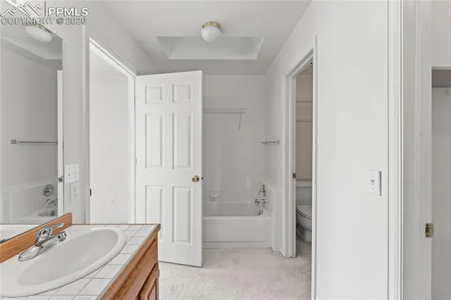 a bathroom that has a glass shower door