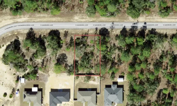 an aerial view of residential house with outdoor space