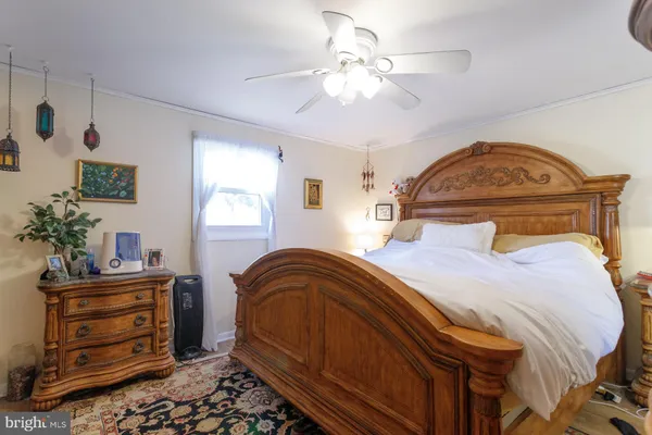 a bed room with a bed and a book shelf