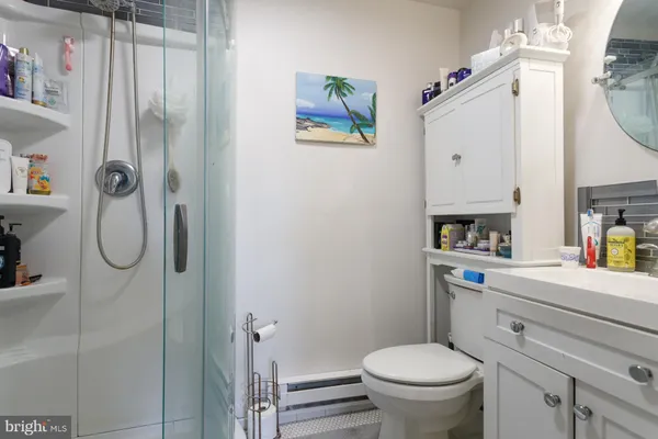 a bedroom with a bed and large windows