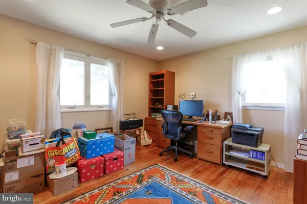 a view of a house with swimming pool and a yard
