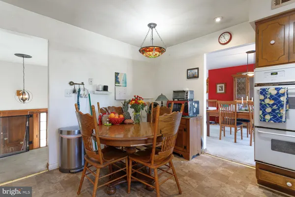 a dining room with furniture window wooden floor