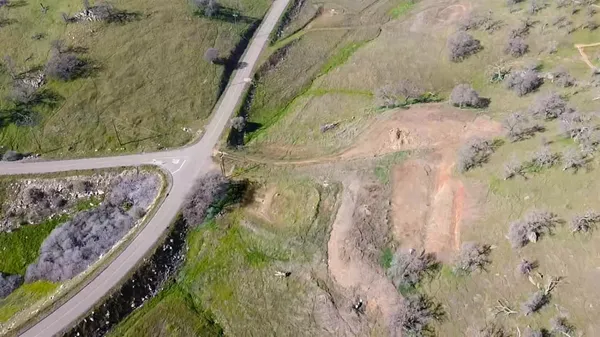 a view of a swimming pool with a yard