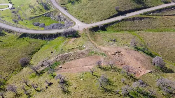 a view of a field with an ocean