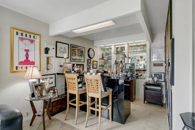 a view of a dining room with furniture and window