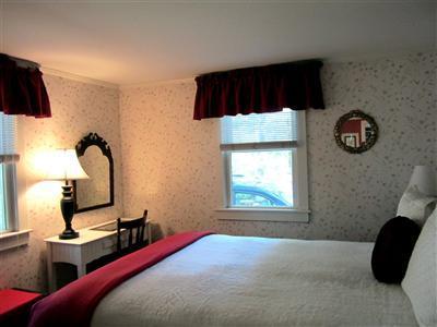 79 Earle Road West Harwich, MA 02671 - Photo 11 of 30 a bedroom with a bed and a chair