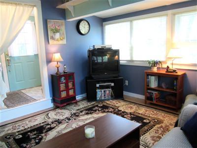 79 Earle Road West Harwich, MA 02671 - Photo 17 of 30 a living room with furniture and a fireplace