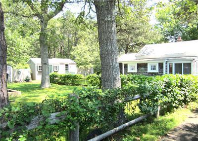 79 Earle Road West Harwich, MA 02671 - Photo 20 of 30 a view of a house with a tree in a yard