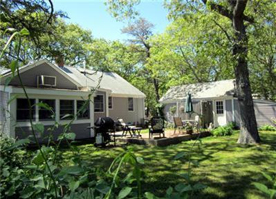 79 Earle Road West Harwich, MA 02671 - Photo 2 of 30 a front view of a house with a yard fountain