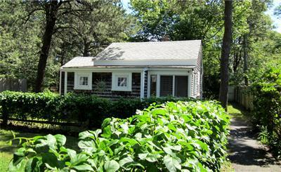 79 Earle Road West Harwich, MA 02671 - Photo 21 of 30 a view of house with a yard and garden