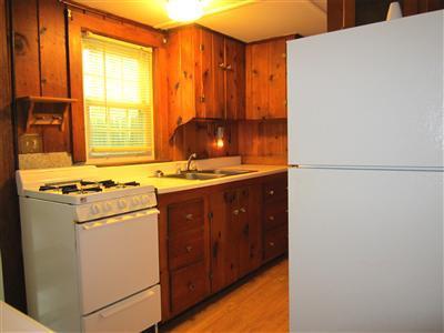 79 Earle Road West Harwich, MA 02671 - Photo 28 of 30 a kitchen with stainless steel appliances a refrigerator and a stove
