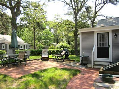 79 Earle Road West Harwich, MA 02671 - Photo 3 of 30 a view of a house with backyard porch and sitting area